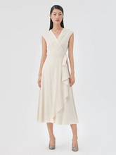 a lady in cream triacetate asymmetrical maxi dress
